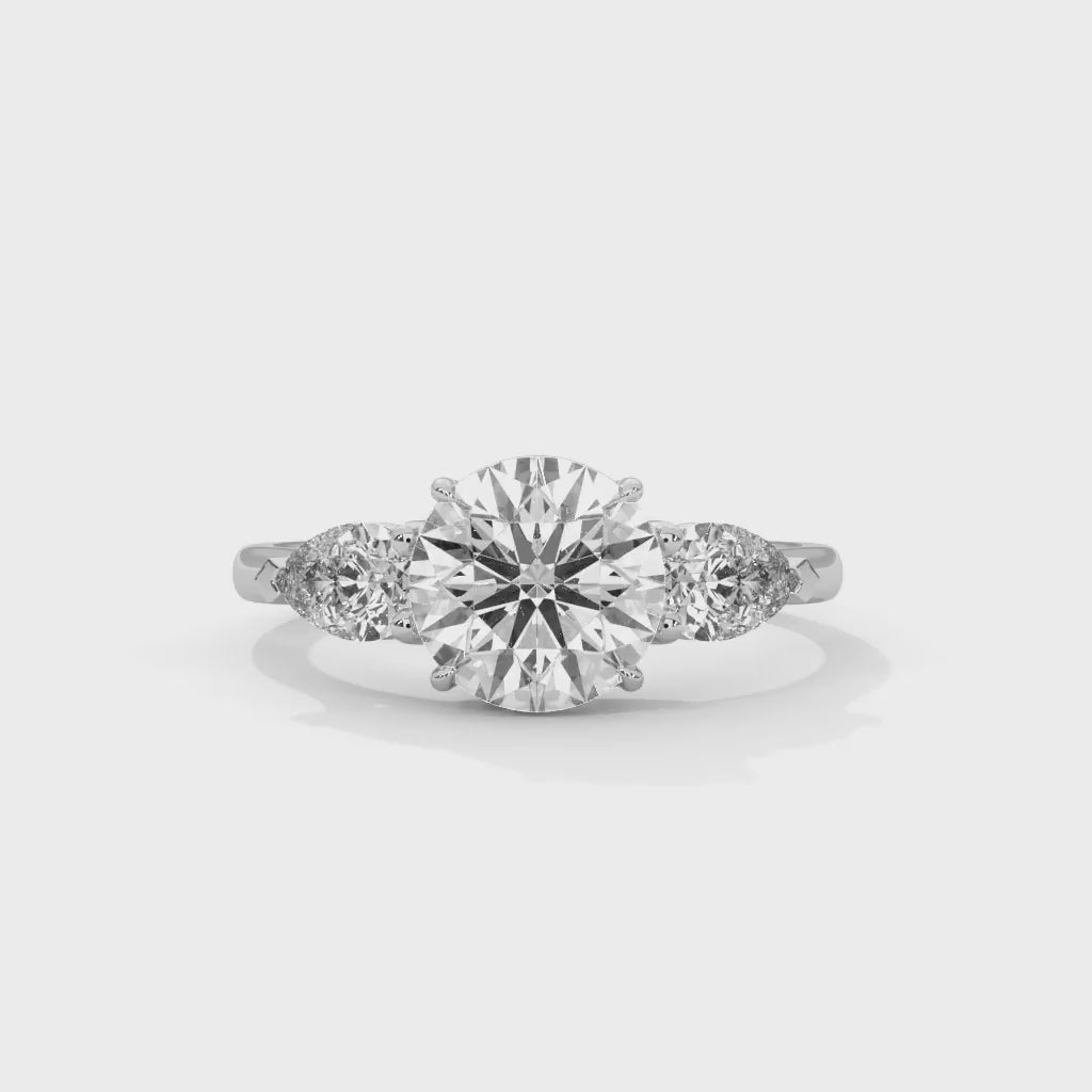 MJBS4 - Round Brilliant Three Stone Pear Accent Ring