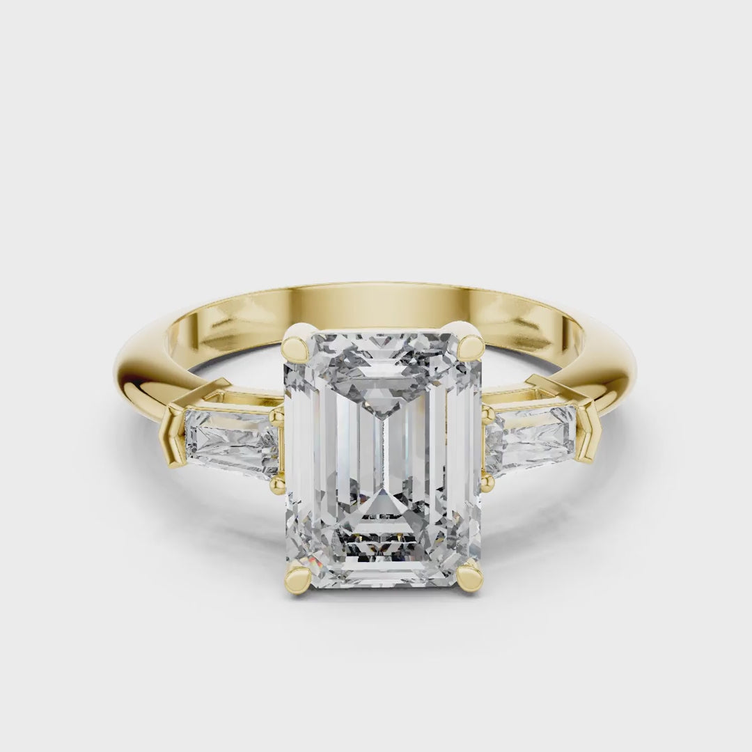 MJR0125 - Classic Emerald Center Stone Flanked by Tapered Baguettes