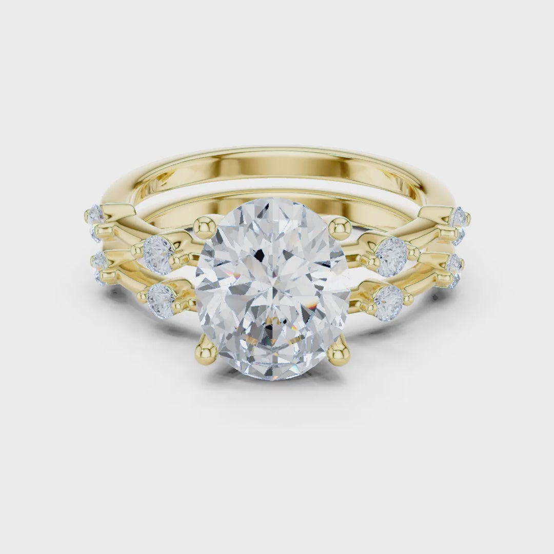 MJTW15 - Oval Cut Solitaire Ring with Stationed Accent Band