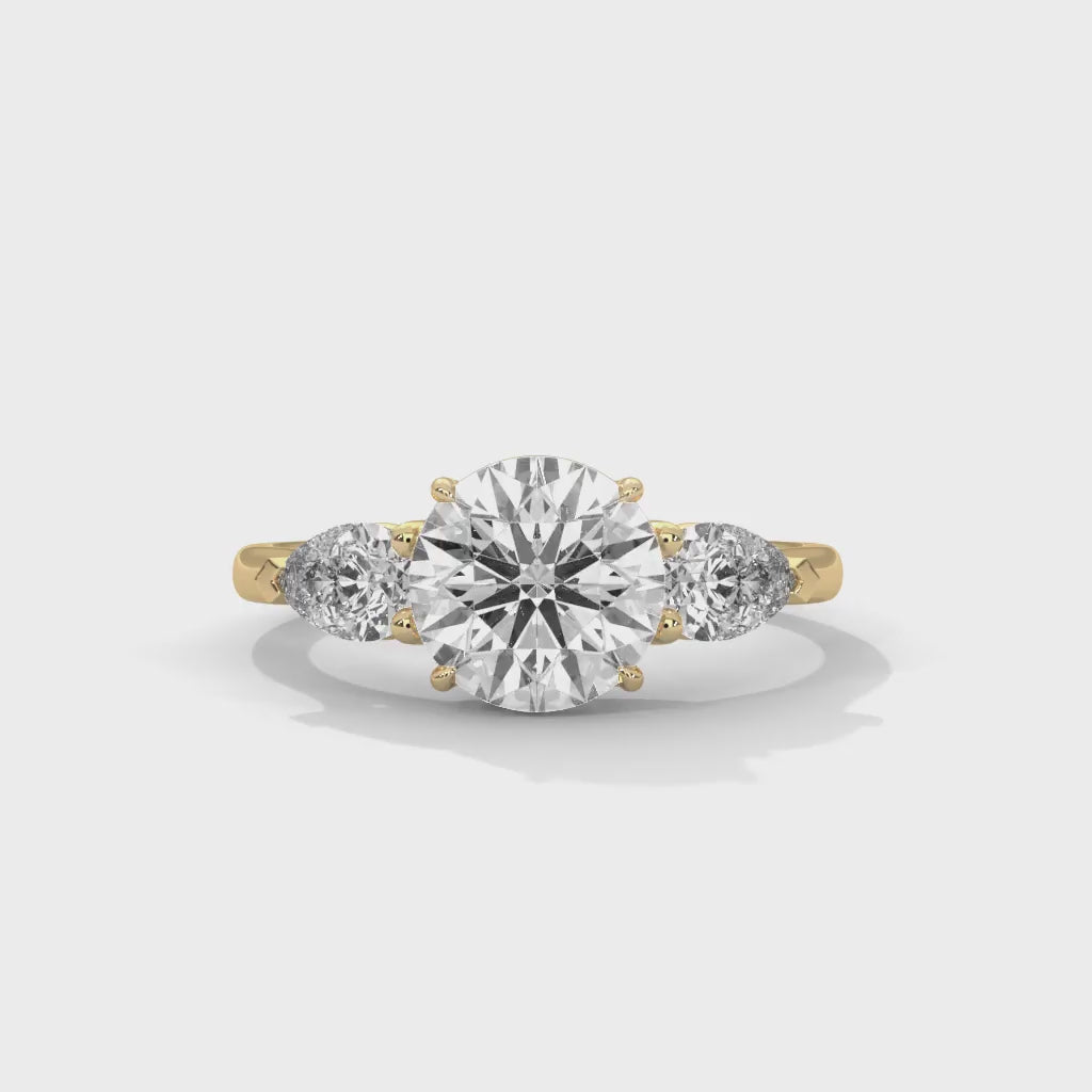 MJBS4 - Round Brilliant Three Stone Pear Accent Ring