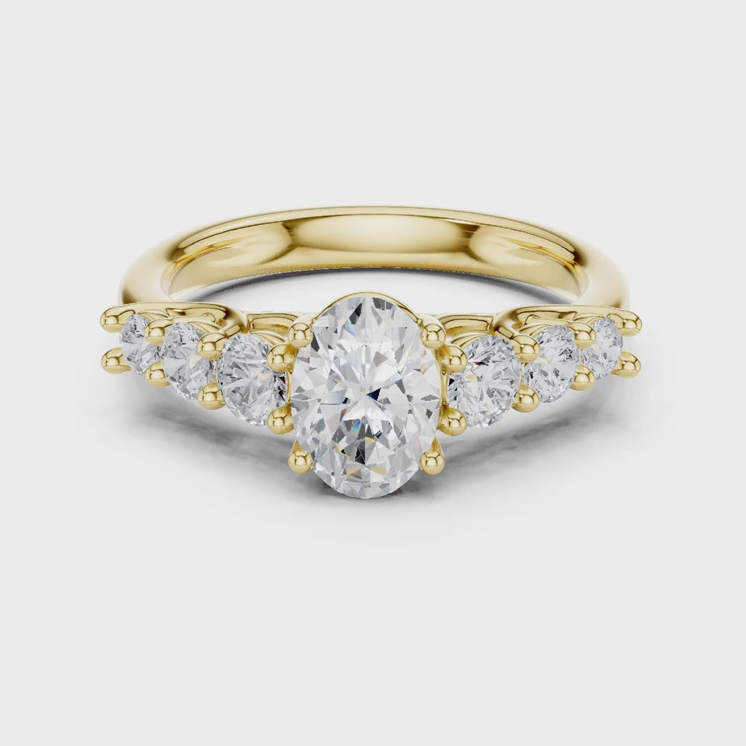 MJR070 - Oval Cut Round Flanked Graduated Accent Ring