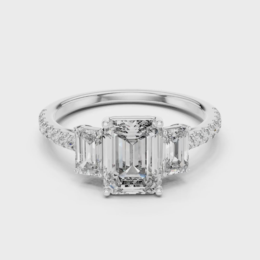 MJR053 - Emerald Cut High Sparkle French Set Three Stone Ring