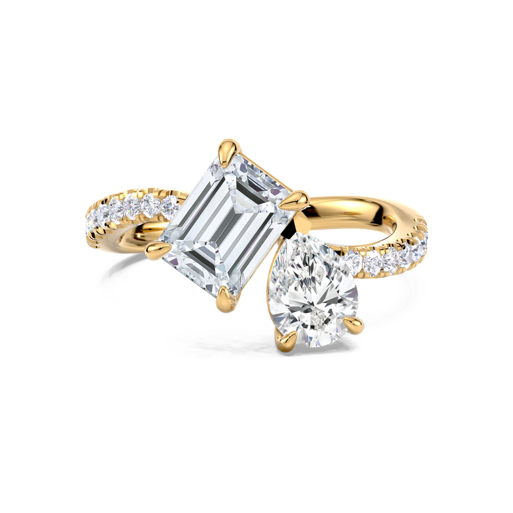 Emerald and pear diamond ring